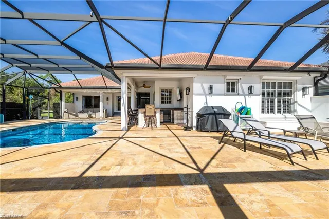 a view of a swimming pool with a patio
