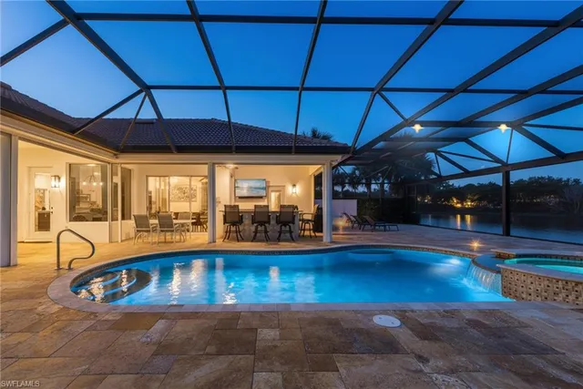 a view of swimming pool with seating area
