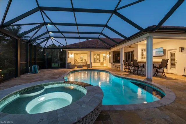 a view of a swimming pool with a patio