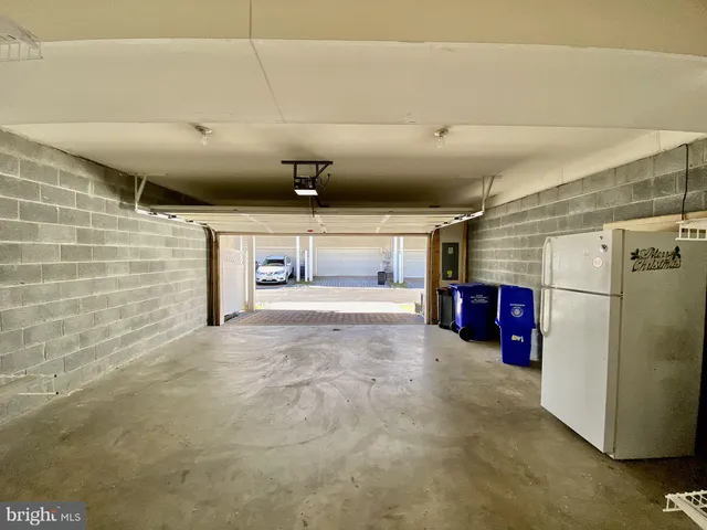 a view of a garage with refrigerator