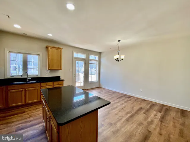 a view of a kitchen with a sink