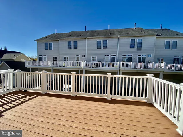 a view of a house with wooden deck