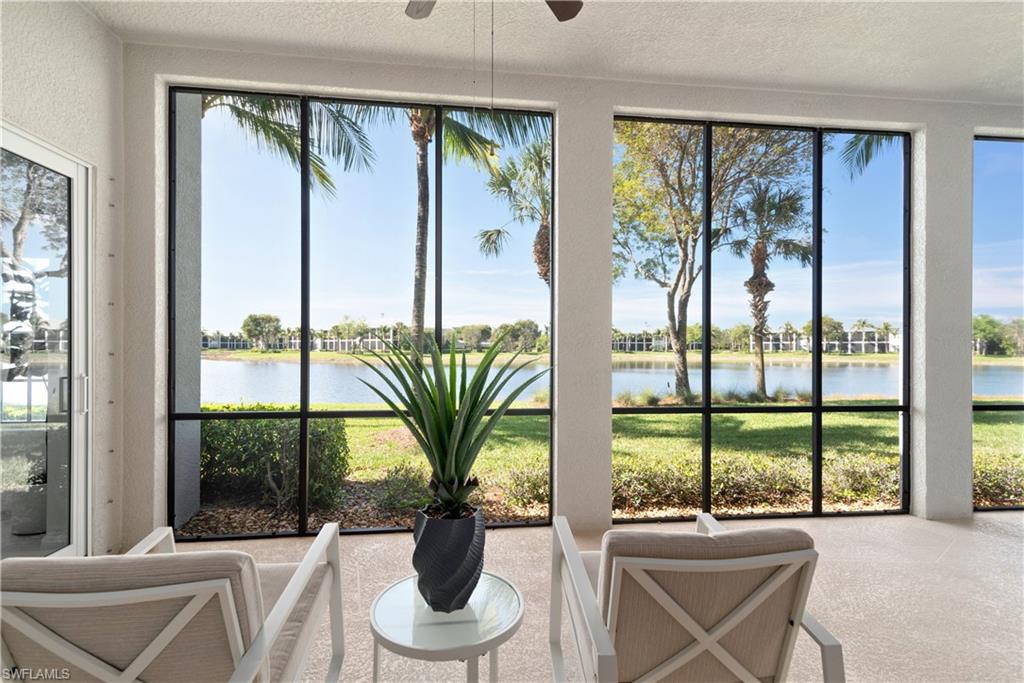 9271 Museo Circle, Unit 102 Naples, FL 34114 - Photo 18 of 35 a living room with furniture and large windows