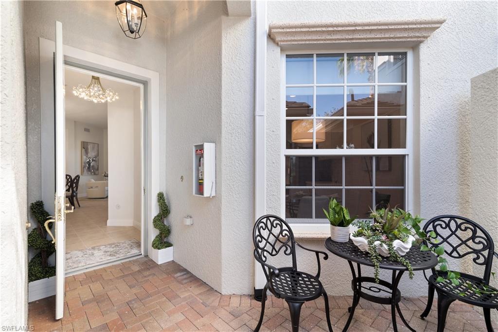 9271 Museo Circle, Unit 102 Naples, FL 34114 - Photo 2 of 35 a view of a livingroom with furniture and front door