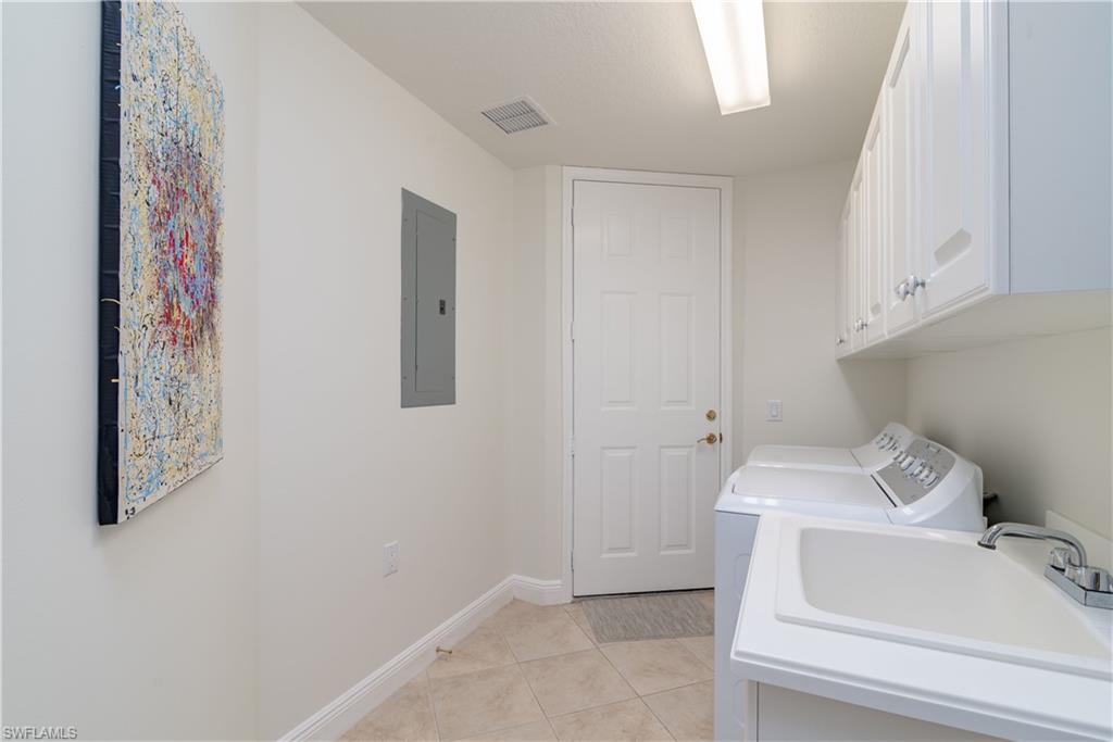 9271 Museo Circle, Unit 102 Naples, FL 34114 - Photo 25 of 35 a bathroom with a sink and toilet
