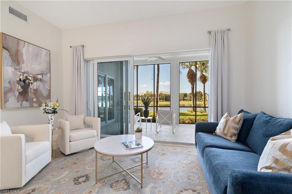 9271 Museo Circle, Unit 102 Naples, FL 34114 - Photo 6 of 35 a living room with furniture and a large window
