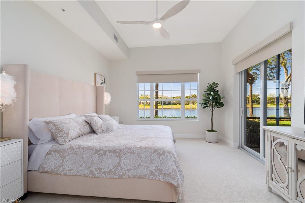 9271 Museo Circle, Unit 102 Naples, FL 34114 - Photo 10 of 35 a spacious bedroom with a large bed and a large window