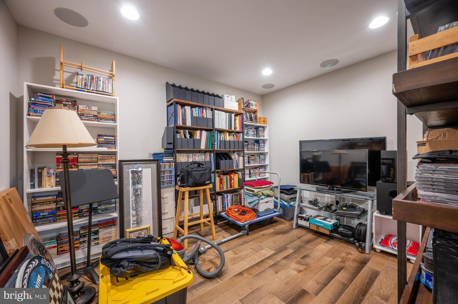 1126 North Stuart Street Arlington, VA 22201 - Photo 11 of 38 a view of a room with gym equipment and a flat screen tv