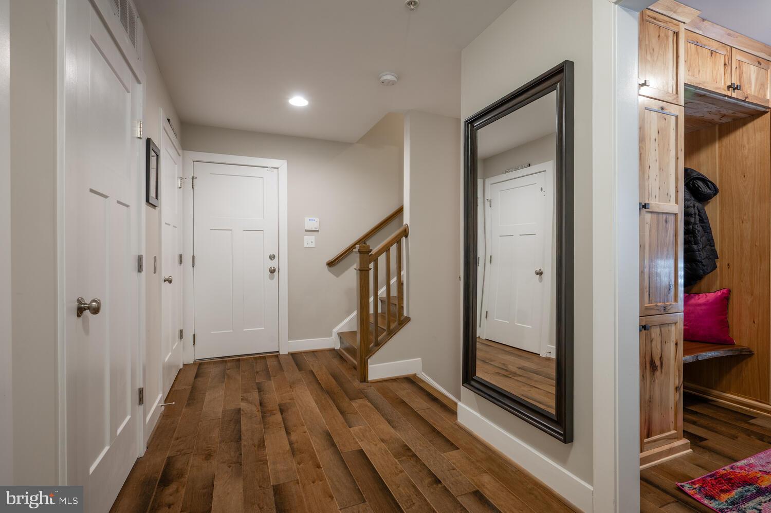 1126 North Stuart Street Arlington, VA 22201 - Photo 27 of 38 a view of a hallway with wooden floor and staircase
