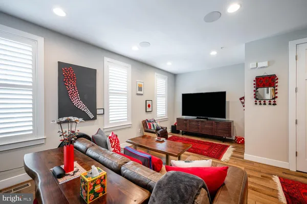 a large kitchen with a table and chairs