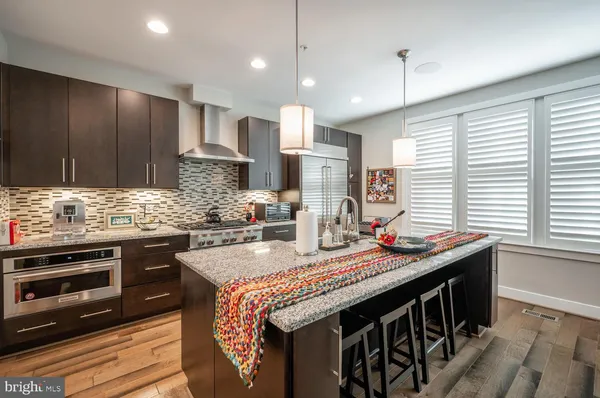 a view of a dining room with furniture and a window