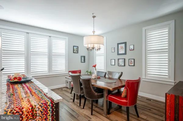 a view of a room with wooden floor and stairs
