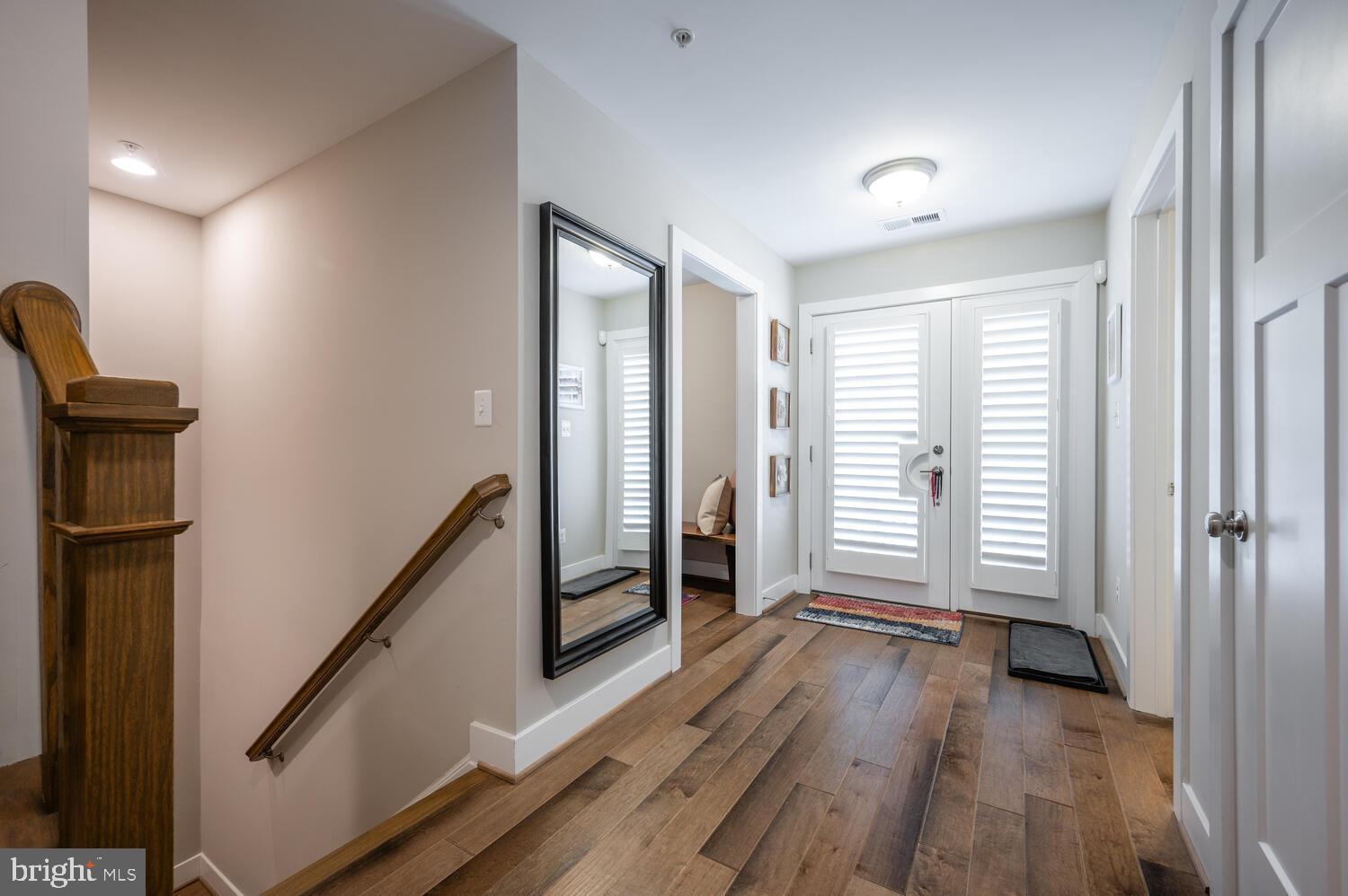 1126 North Stuart Street Arlington, VA 22201 - Photo 33 of 38 a view of a room with wooden floor and stairs
