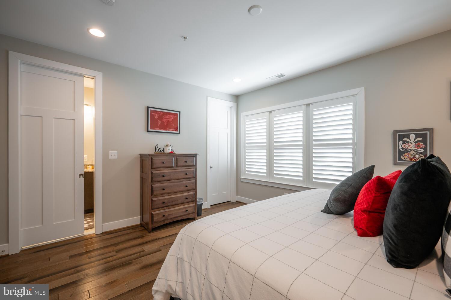 1126 North Stuart Street Arlington, VA 22201 - Photo 35 of 38 a bedroom with a bed and wooden floor