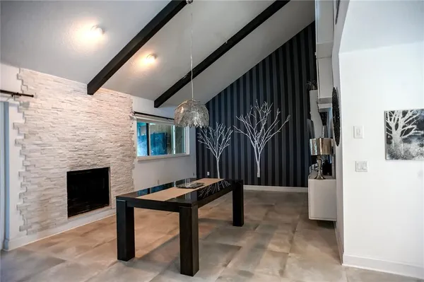 a living room with a couch and a fireplace