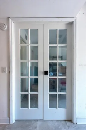 a view of an empty room with empty shelves