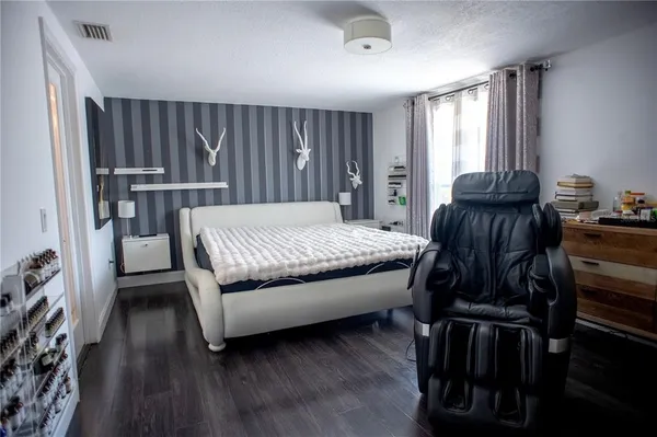 a bed room with a bed and a window