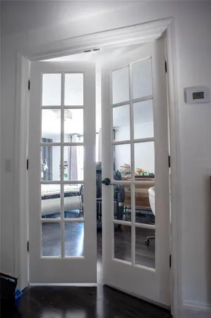 a view of a livingroom with wooden floor and a window