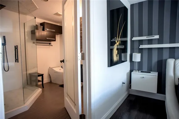 a kitchen with a refrigerator and microwave