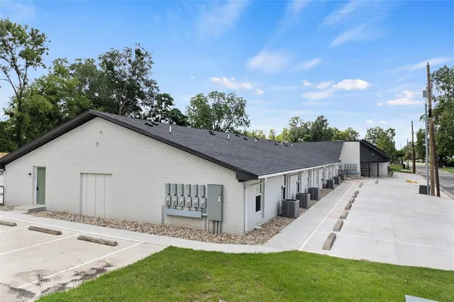 a view of house with yard and entertaining space