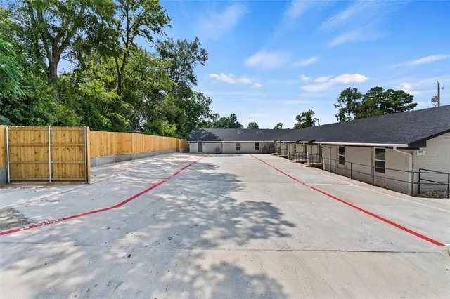 a view of house with a yard