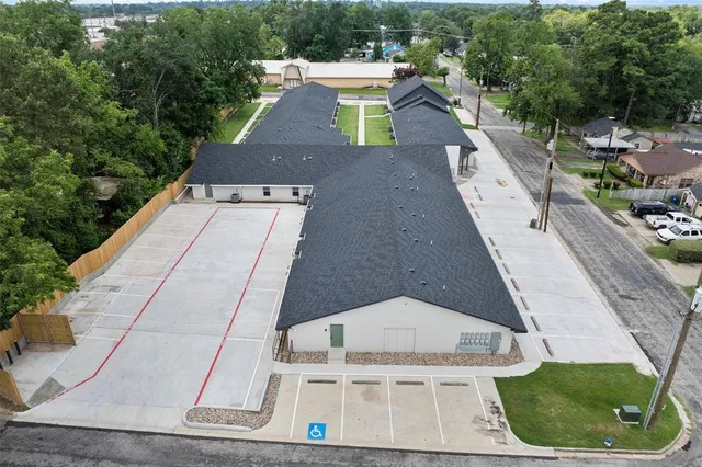 a aerial view of a house with a yard