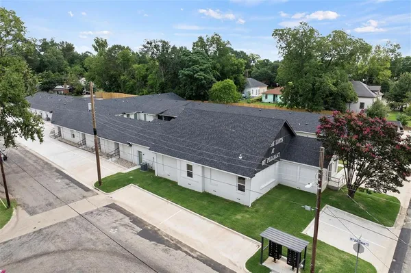 an aerial view of a house having yard