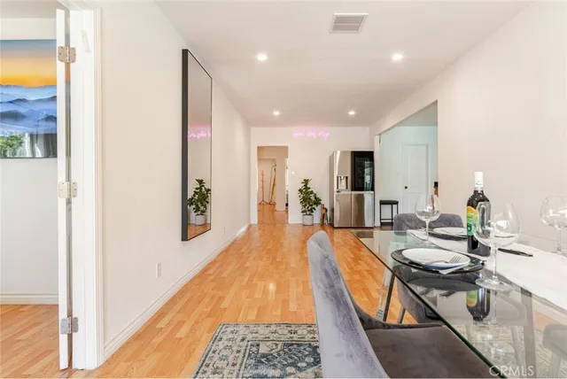 a very nice looking dining room with a large window