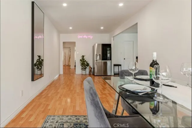 a very nice looking dining room with a table and chairs