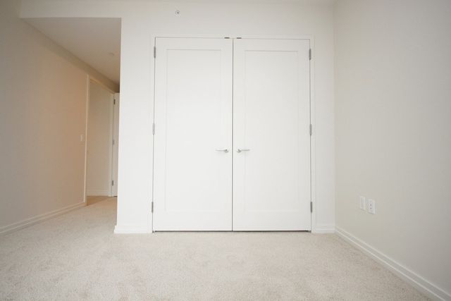 a bathroom with a sink toilet vanity and shower