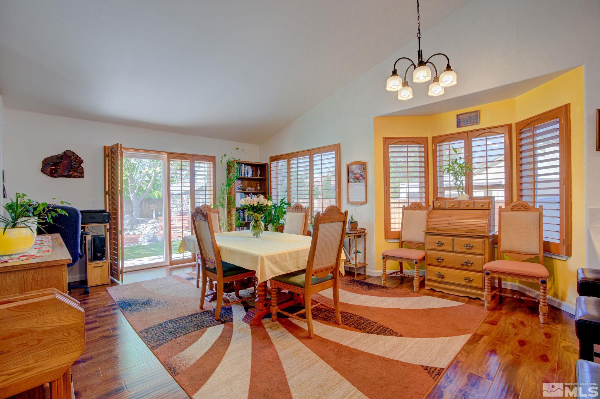 1315 Wrangler Circle Minden, NV 89423 - Photo 13 of 40 a view of a dining room with furniture window and wooden floor