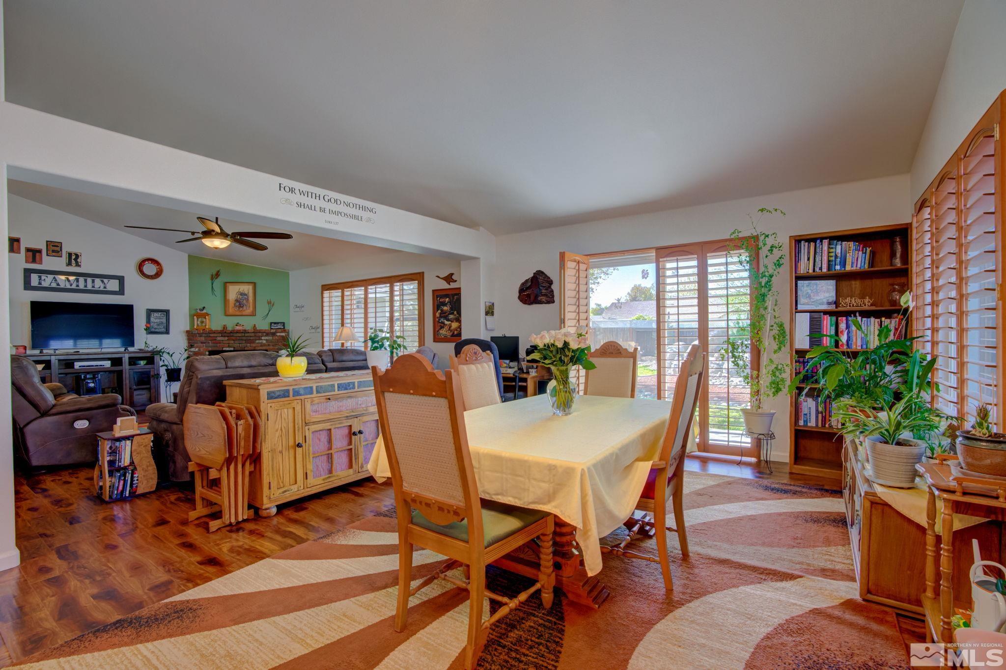 1315 Wrangler Circle Minden, NV 89423 - Photo 14 of 40 a view of a dining room with furniture window and wooden floor