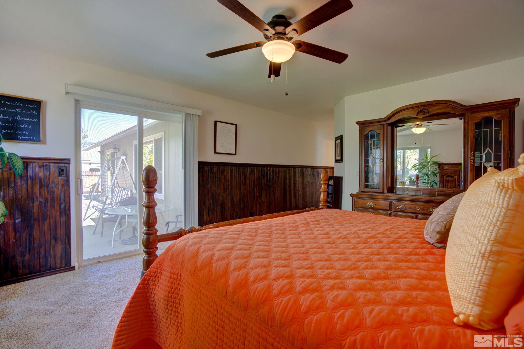 1315 Wrangler Circle Minden, NV 89423 - Photo 18 of 40 a bed room with a bed and a large mirror