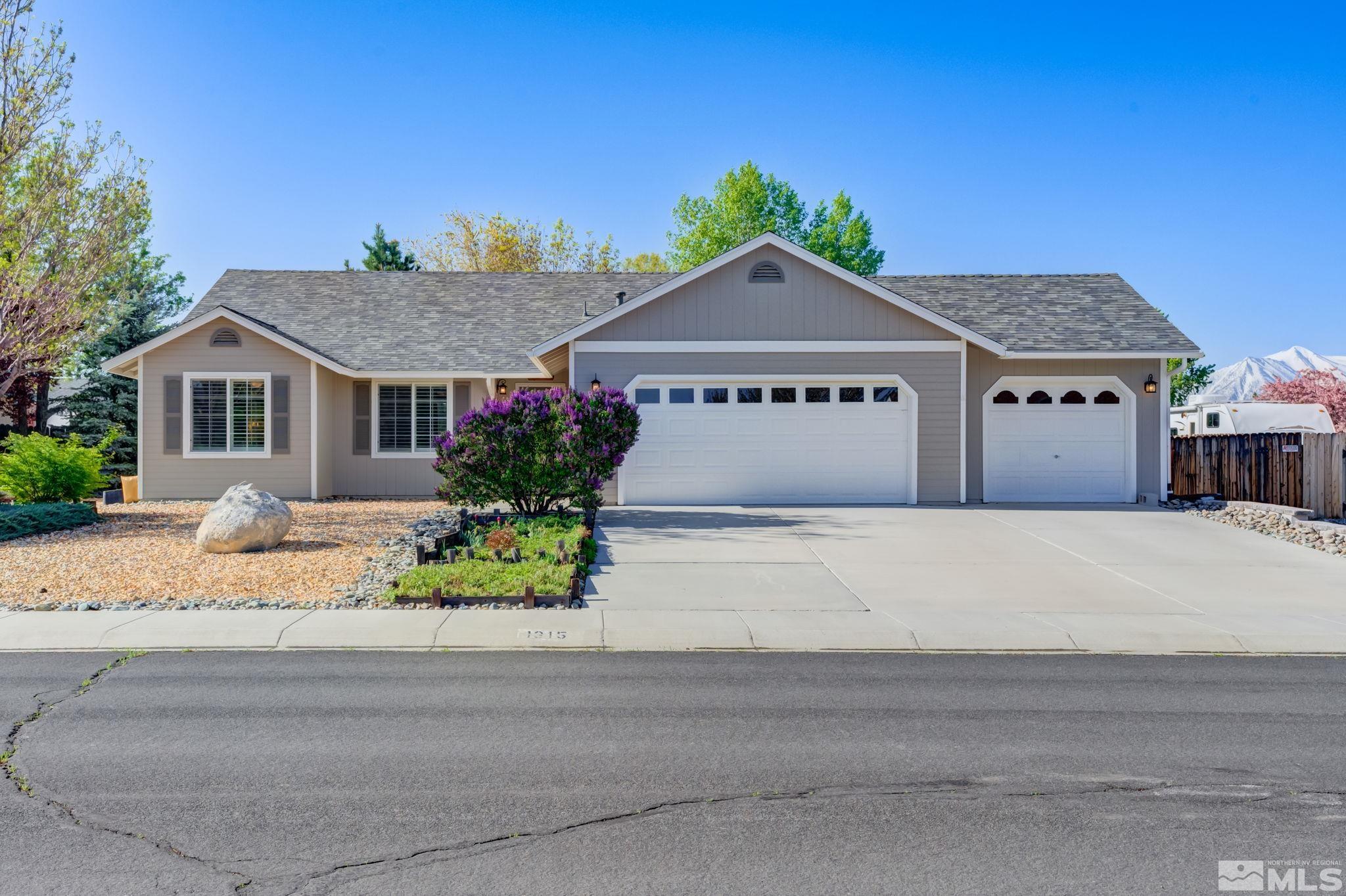 1315 Wrangler Circle Minden, NV 89423 - Photo 2 of 40 a front view of a house with a yard
