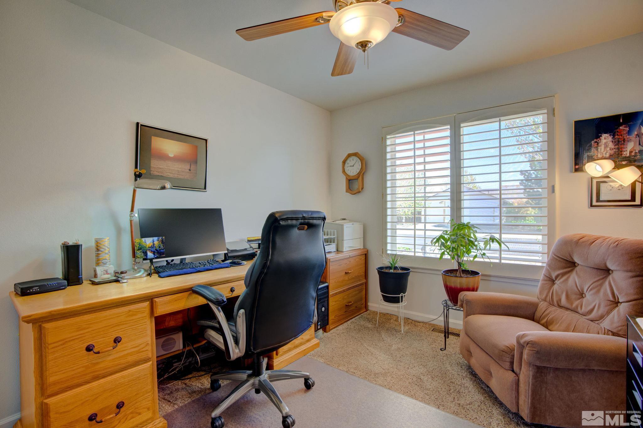 1315 Wrangler Circle Minden, NV 89423 - Photo 26 of 40 a view of a workspace with furniture and a window