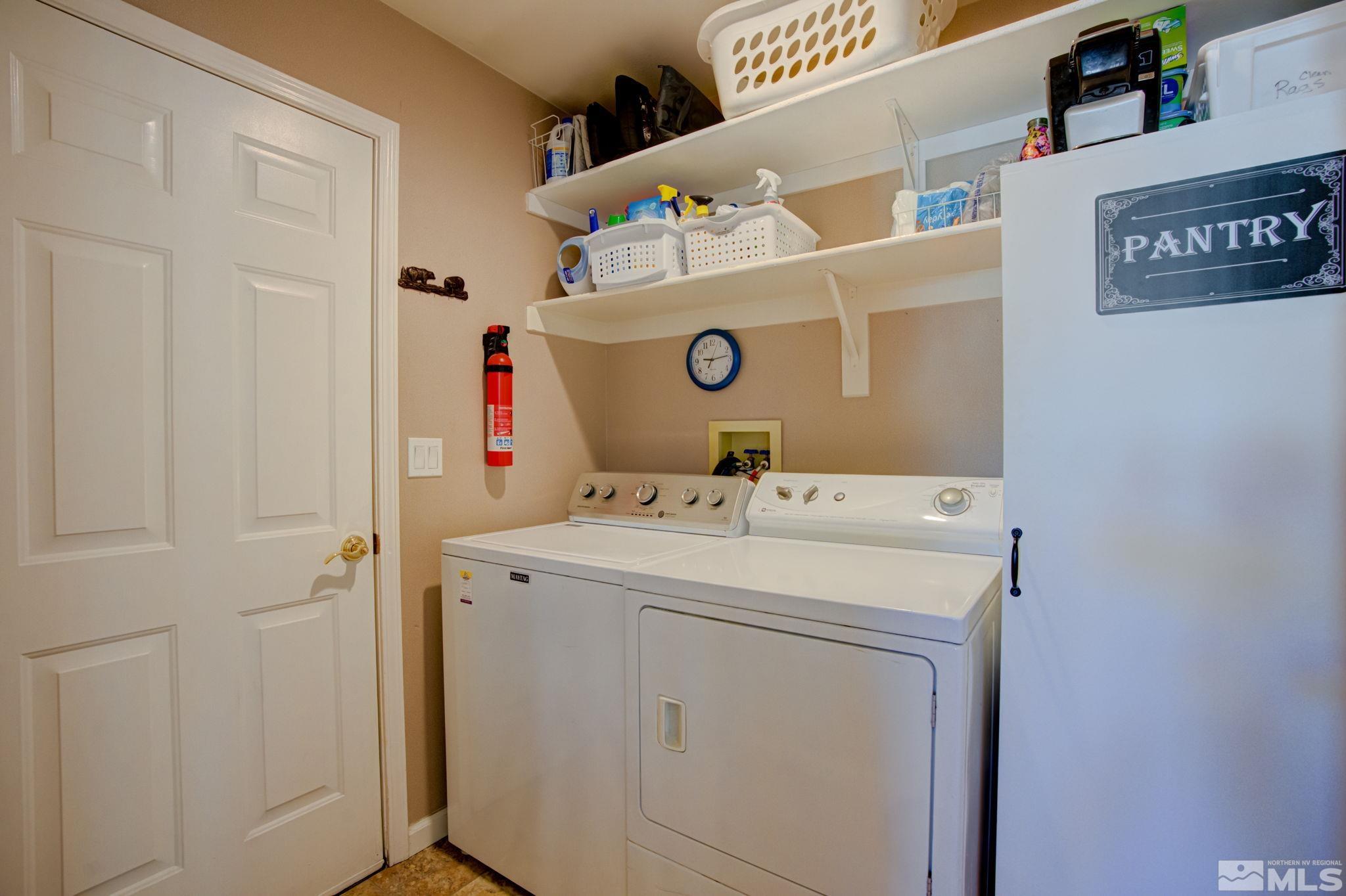 1315 Wrangler Circle Minden, NV 89423 - Photo 28 of 40 a utility room with dryer and washer