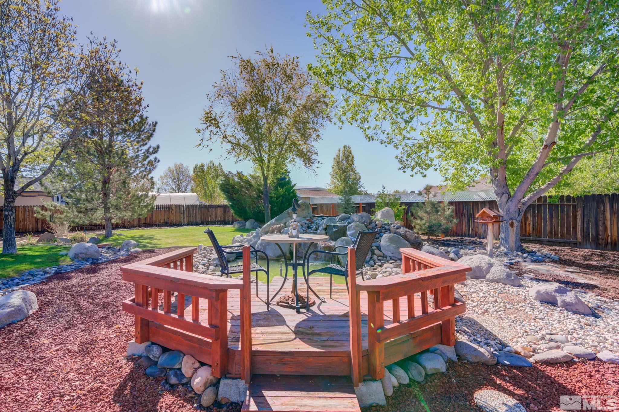 1315 Wrangler Circle Minden, NV 89423 - Photo 31 of 40 a view of a patio with chairs and a table