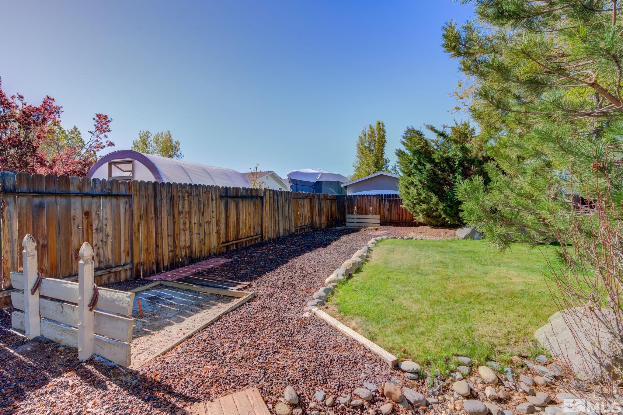 1315 Wrangler Circle Minden, NV 89423 - Photo 35 of 40 a view of a backyard with a garden