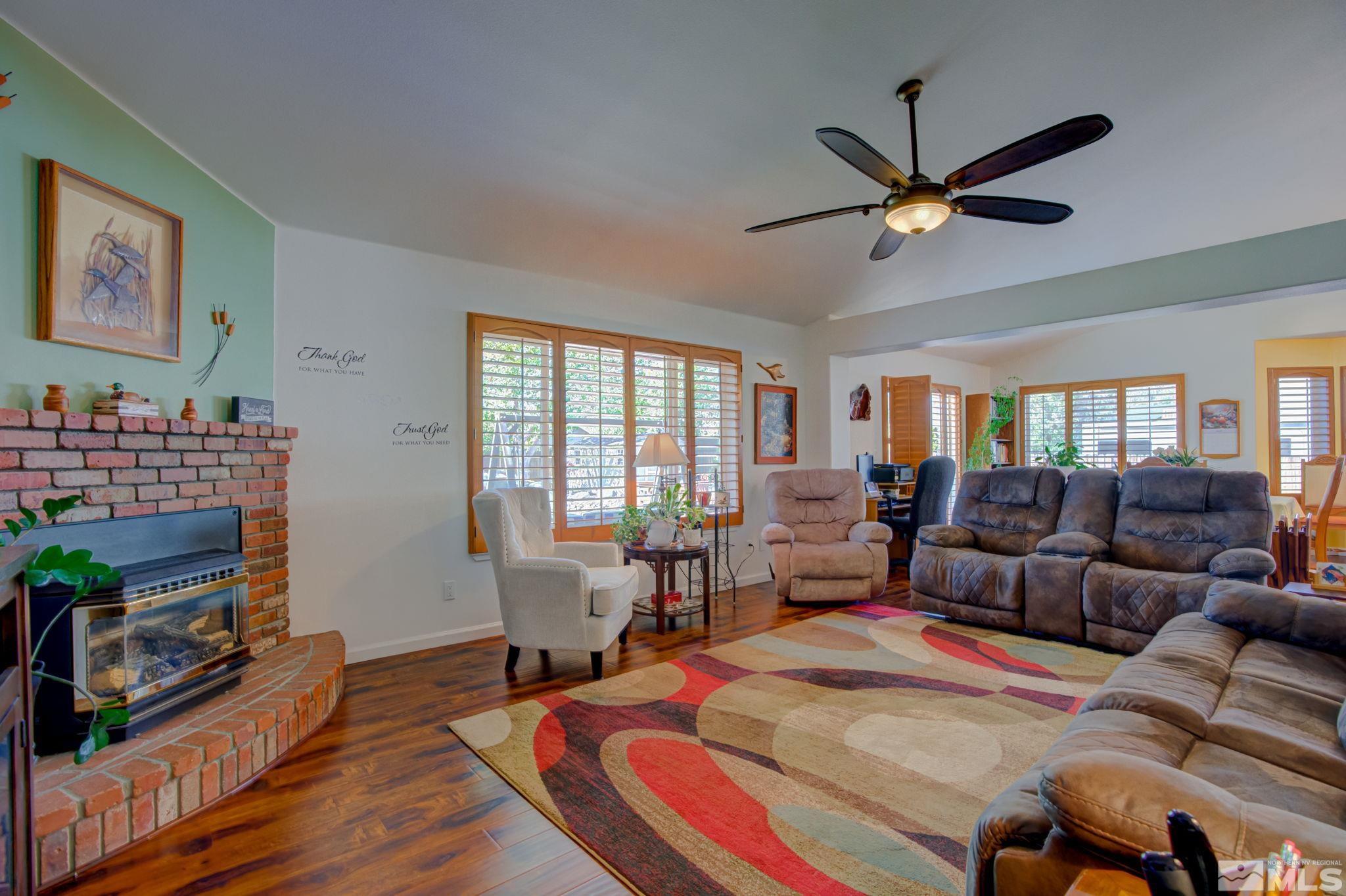 1315 Wrangler Circle Minden, NV 89423 - Photo 5 of 40 a living room with furniture a fireplace and a window