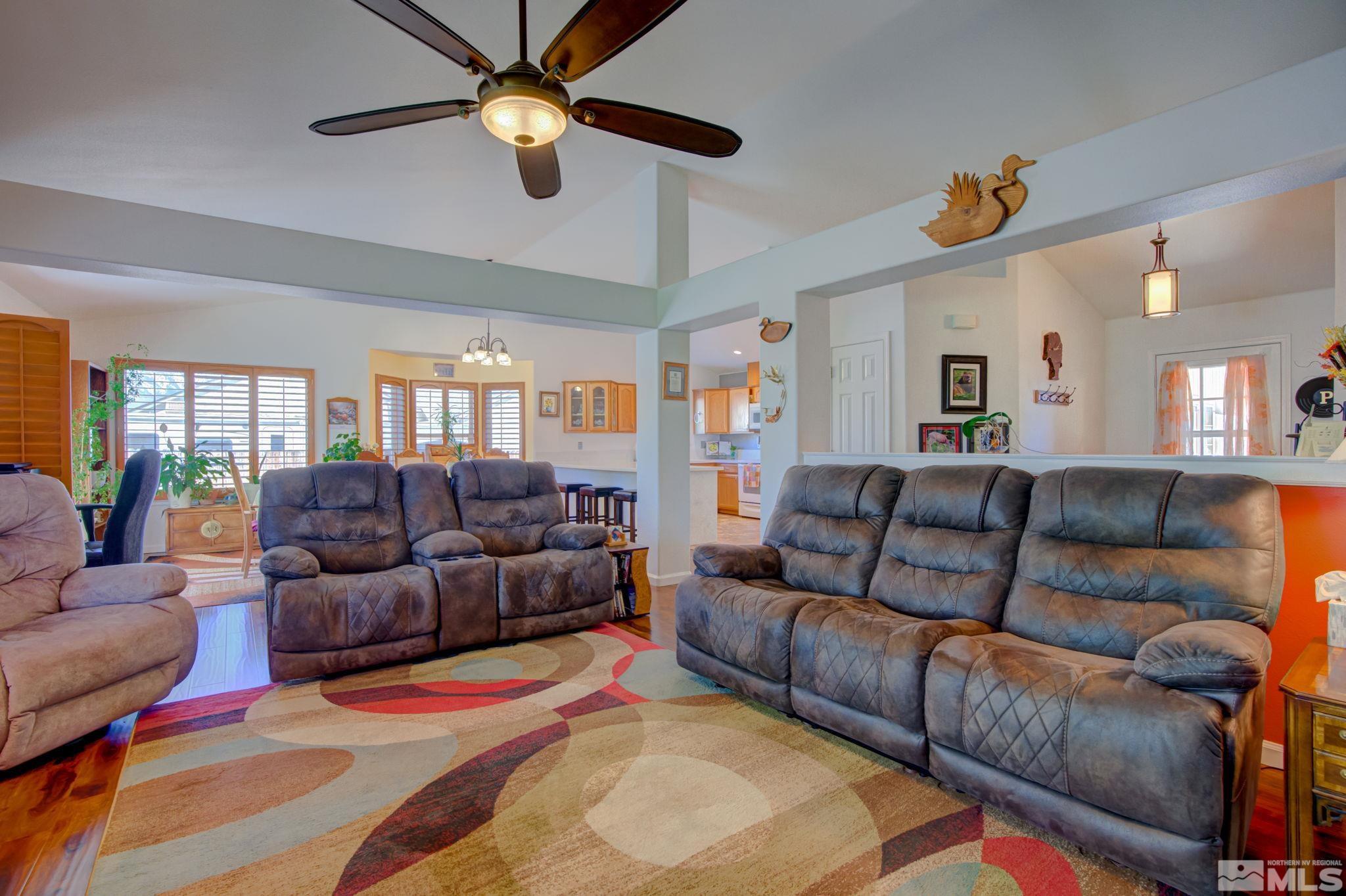 1315 Wrangler Circle Minden, NV 89423 - Photo 8 of 40 a living room with furniture and a chandelier