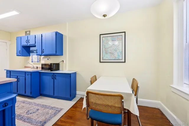 a bed room with a chair and a dresser