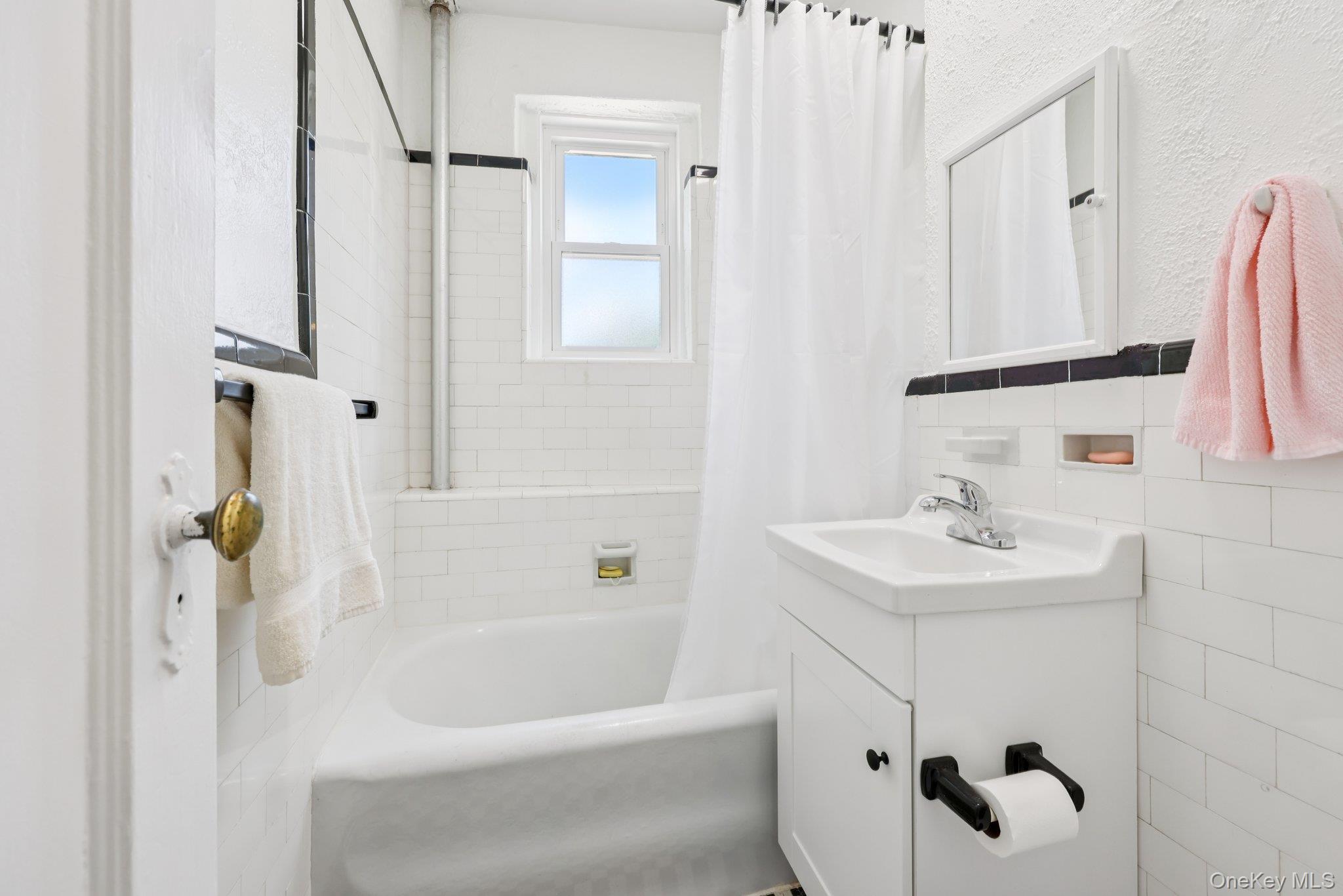 2 Lockwood Avenue, Unit 3D Bronxville, NY 10708 - Photo 7 of 12 a bathroom with a sink a toilet and shower