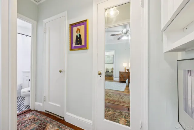 a view of a bathroom from the hallway