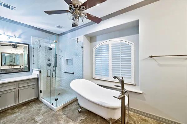 a bathroom with a shower sink and mirror