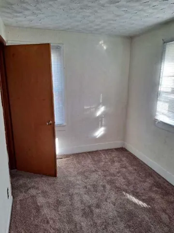 a bathroom with a toilet a sink and bathtub