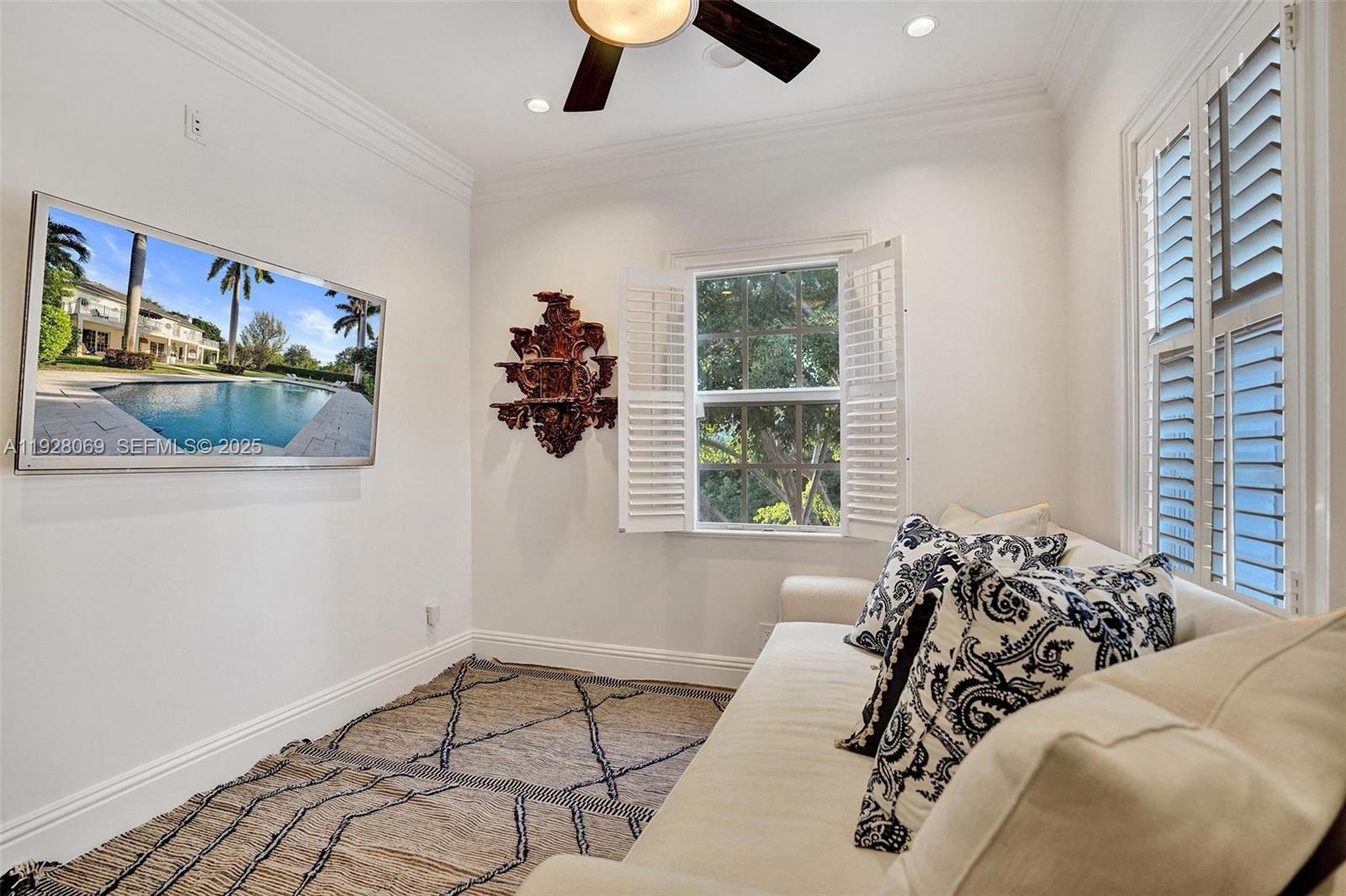 1281 Banyan Road Boca Raton, FL 33432 - Photo 46 of 69 a bed sitting in a bedroom next to a window