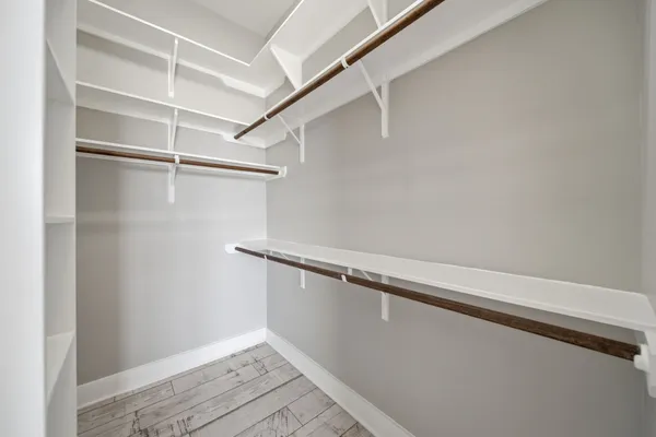 a view of an empty walk in closet