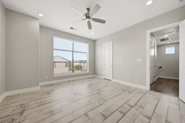 a view of an empty room with a window