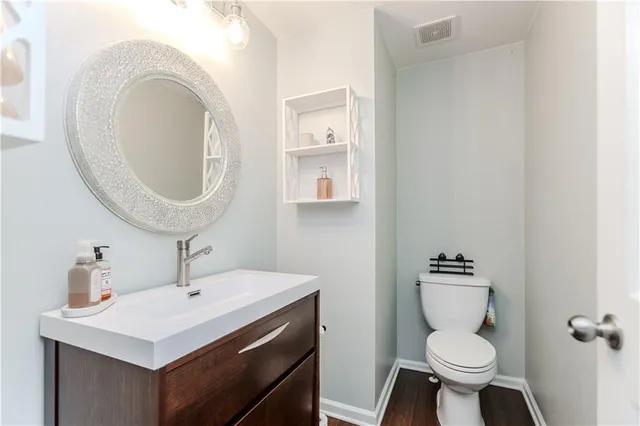 a bedroom with a bed and a chair