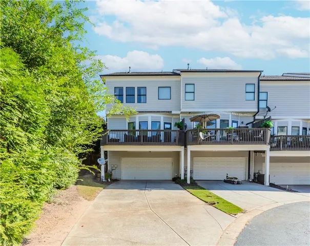 a view of house with outdoor space and sitting area